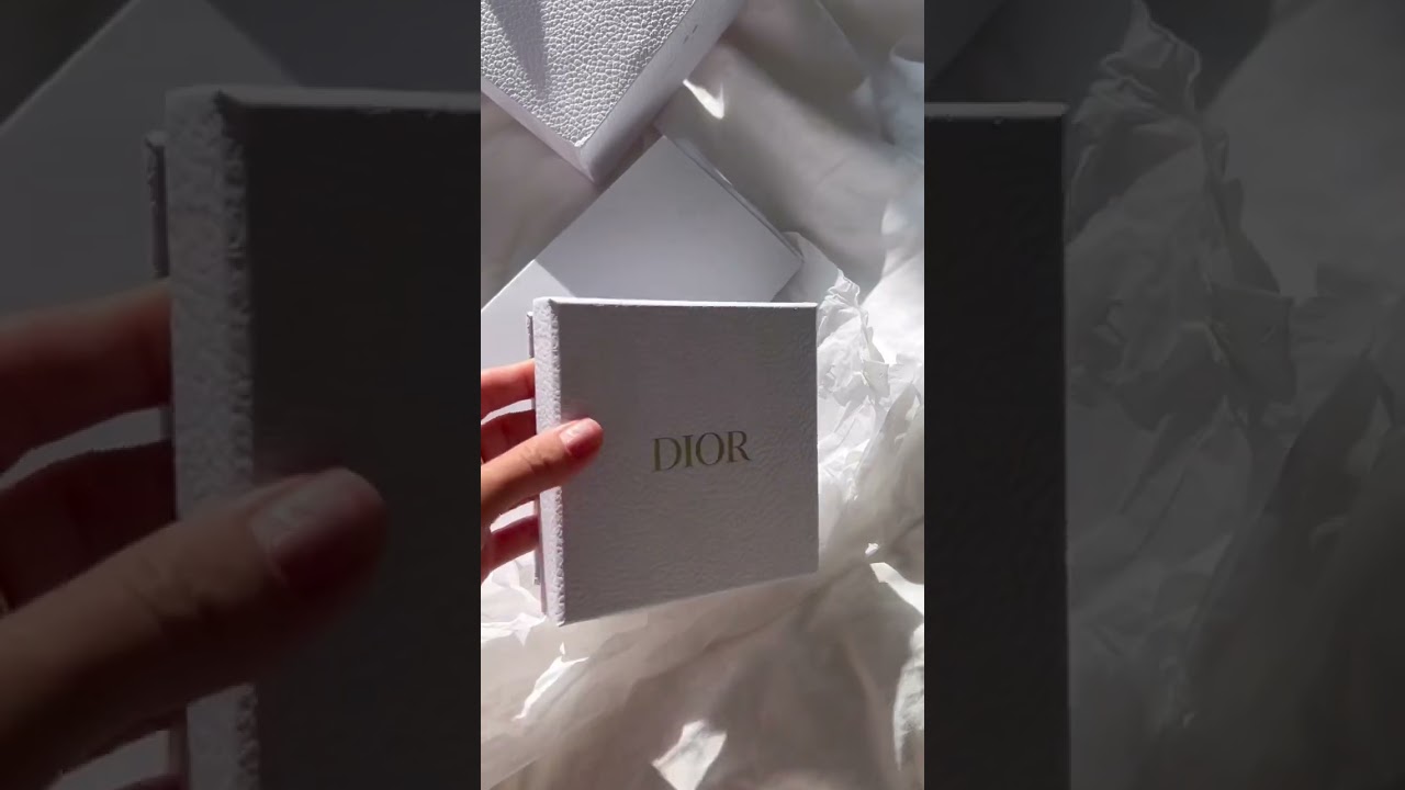 Unpacking Dior earrings .